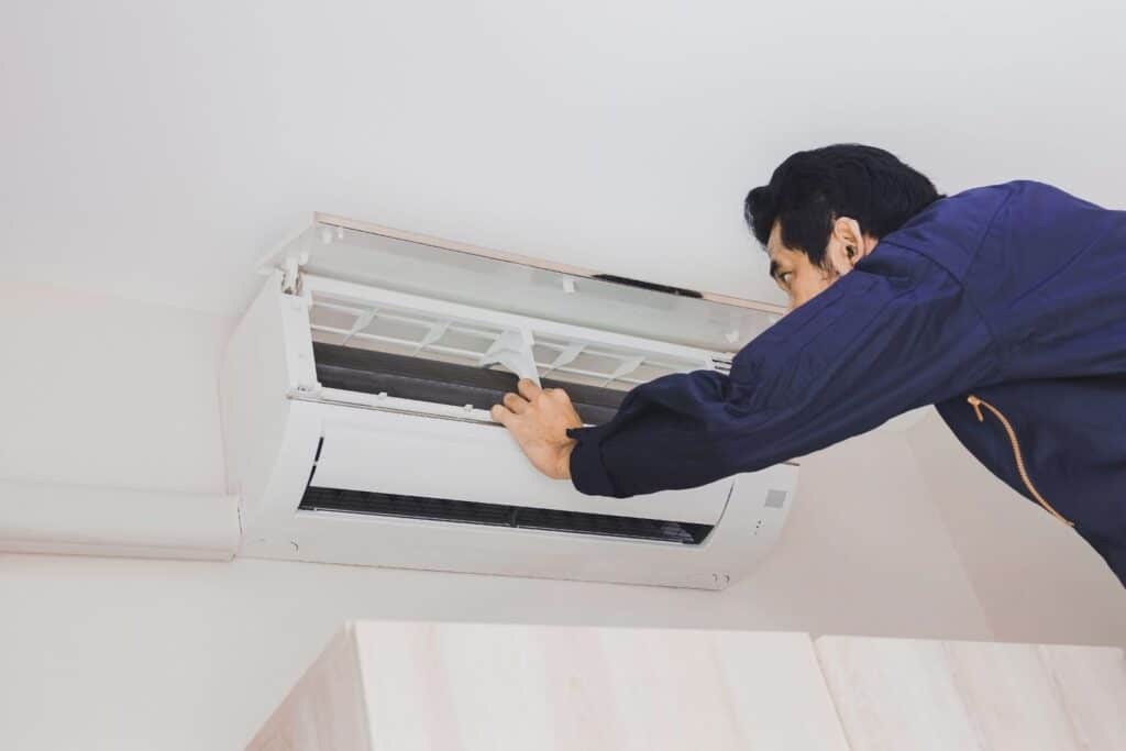 inspecting heat pump in Tauranga